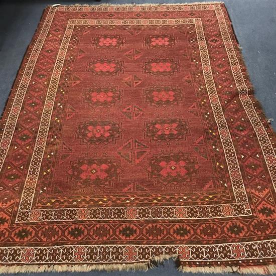 A red ground rug 218cm x 151cm